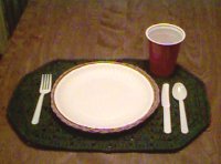 Placemat with table setting.
